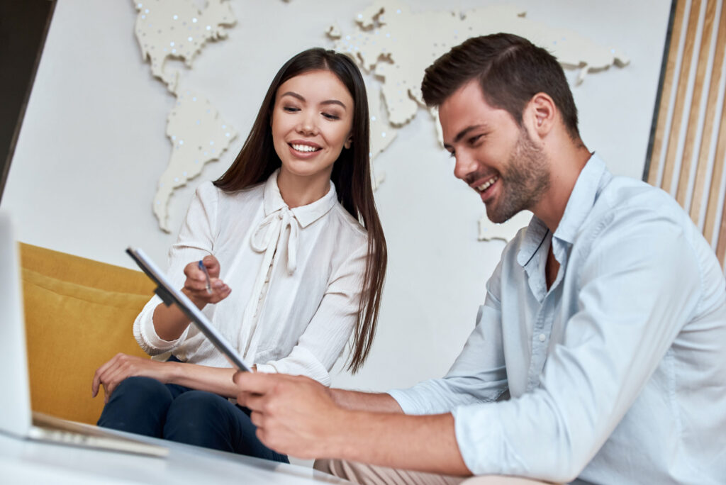 young man reviewing contract for a trip with agent 2021 10 30 00 18 20 utc 1024x684 1