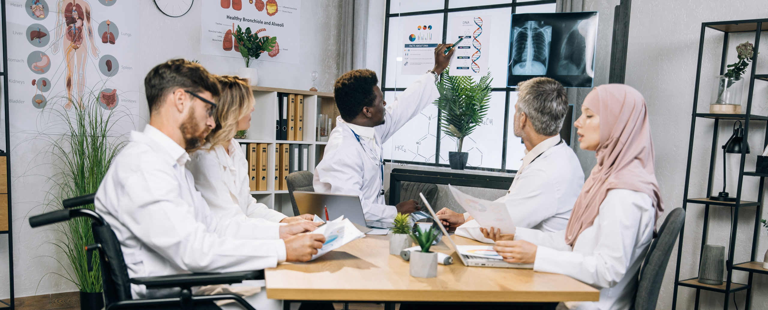 diverse doctors talking about progress in medicine 2021 10 13 02 01 50 utc scaled 1