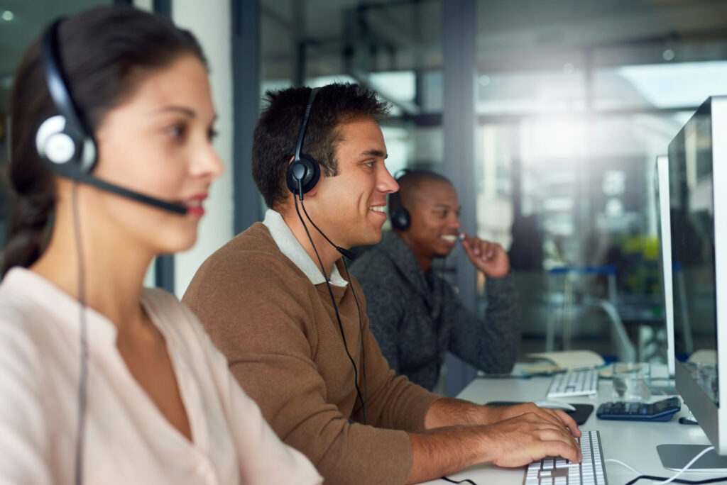 Shot of call centre agents working in an office.